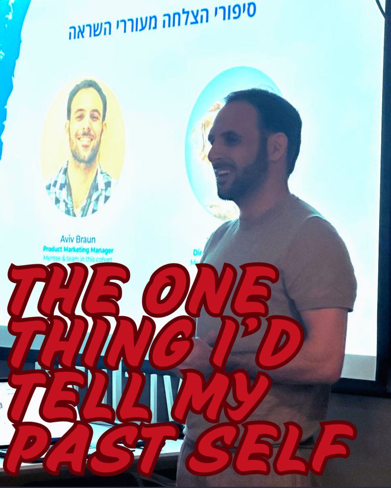 Aviv Braun on stage giving a talk titled The One Thing I'd Tell My Past Self